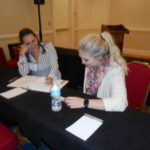 Attendees strategizing for skit