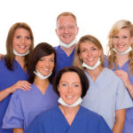 Pediatric dentist and team of assistants